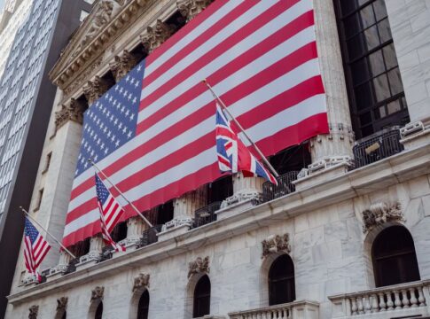 Wall Street muscles higher despite more swings for AI stocks — Economy coverage by Daily American Press. Photo: Mizuno K v...